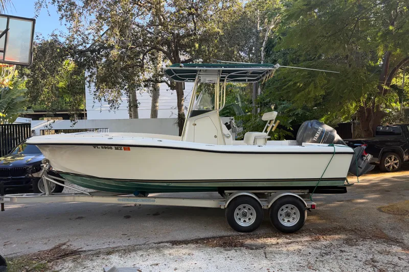 Slide: The Image of Custom Yacht Tender 23 Center Console 2003 on trailer, parked outdoors. - 3