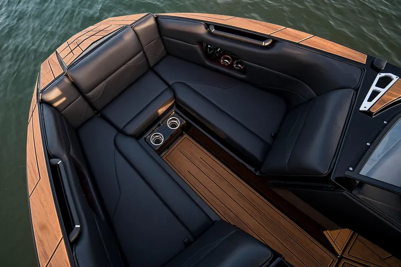 Slide: The Image of Manufacturer Provided Image: Luxurious interior of 2026 Moomba Mojo boat with sleek black seating and wooden accents. - 2