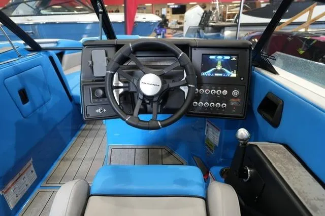 Slide: The Image of 2026 Moomba Mojo boat dashboard with steering wheel and control panel. - 21