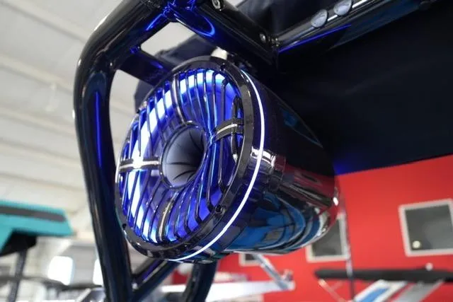 Slide: The Image of 2026 Moomba Mojo boat speaker with blue LED lighting in a modern setting. - 27