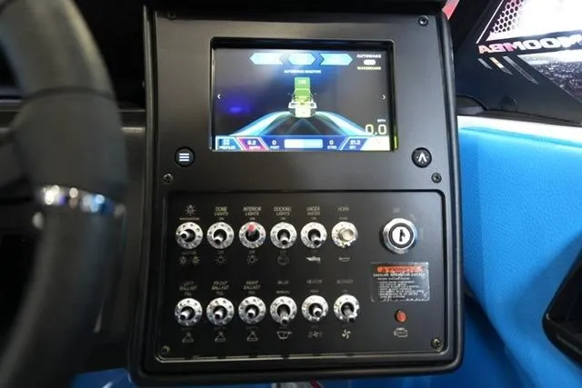 Slide: The Image of 2026 Moomba Mojo dashboard with touchscreen and control panel. - 28