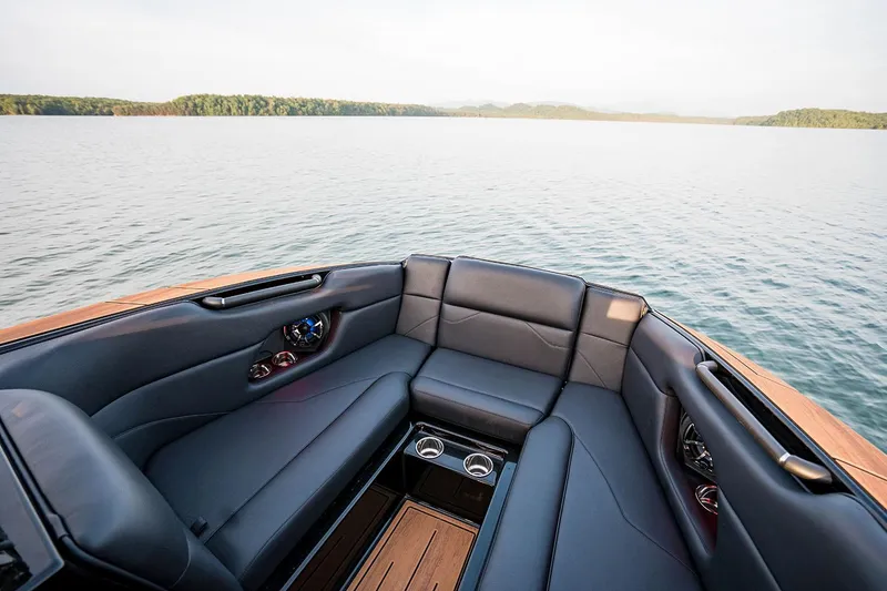 Slide: The Image of Manufacturer Provided Image: 2026 Moomba Mojo boat interior with luxurious seating on a serene lake. - 3