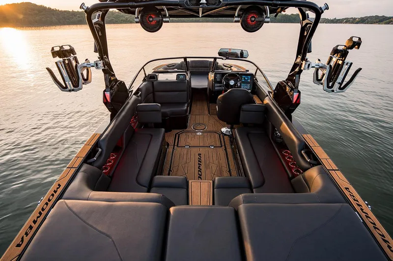 Slide: The Image of Manufacturer Provided Image: 2026 Moomba Mojo boat interior with sleek seating and advanced dashboard on a serene lake. - 7