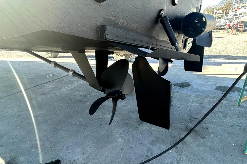 Slide: The Image of 1999 Navigator 5300 boat propeller and rudder system on dry dock. - 102