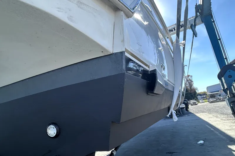 Slide: The Image of 1999 Navigator 5300 yacht in dry dock, showing hull and maintenance equipment. - 108