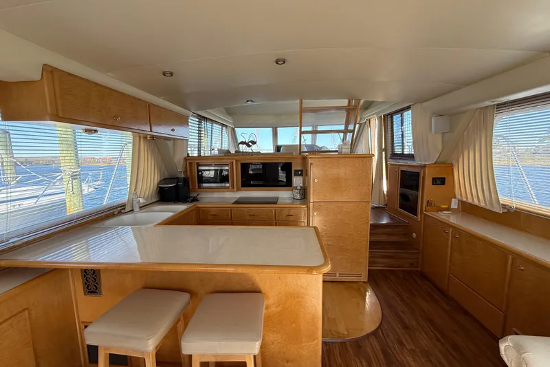Slide: The Image of Luxurious 1999 Navigator 5300 yacht interior with modern kitchen and panoramic windows. - 14