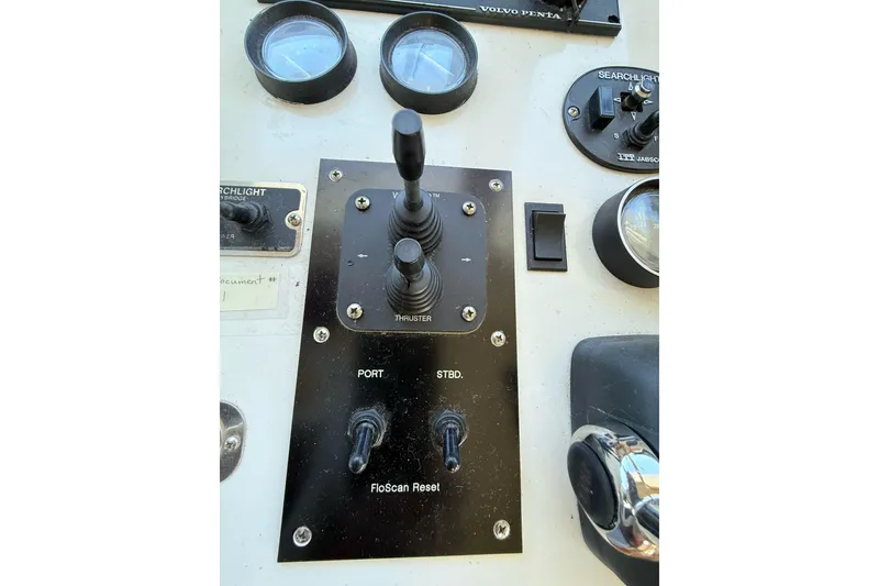 Slide: The Image of Control panel of a 1999 Navigator 5300 boat with various switches and gauges. - 29