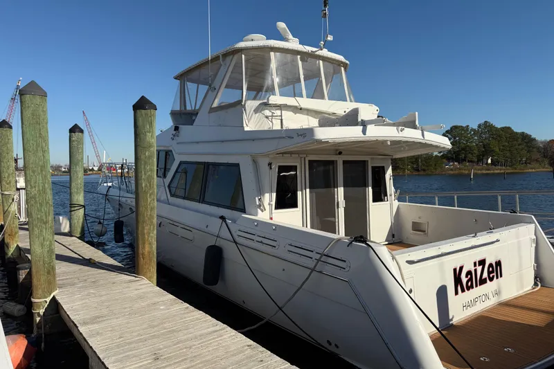 Slide: The Image of 1999 Navigator 5300 yacht docked at a marina, named "KaiZen" from Hampton, VA. - 3
