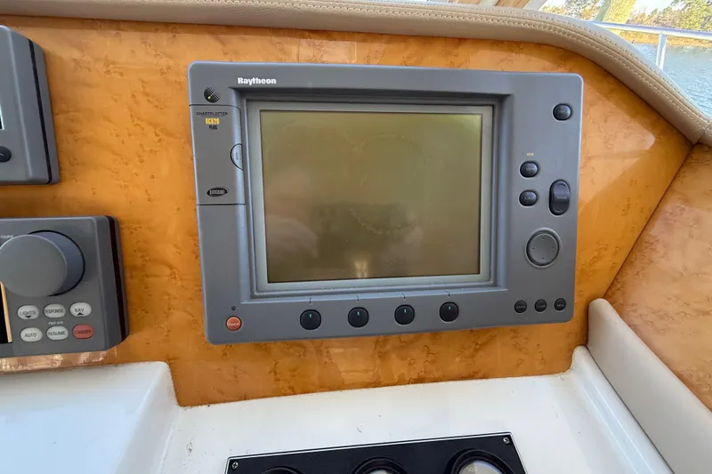 Slide: The Image of Raytheon marine navigation system on 1999 Navigator 5300 yacht dashboard. - 34