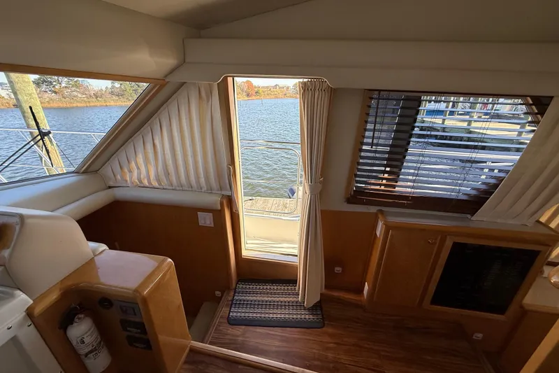 Slide: The Image of Interior view of 1999 Navigator 5300 yacht with water view through windows. - 36