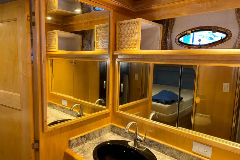 Slide: The Image of Luxurious bathroom interior of 1999 Navigator 5300 yacht with wooden accents and modern fixtures. - 44