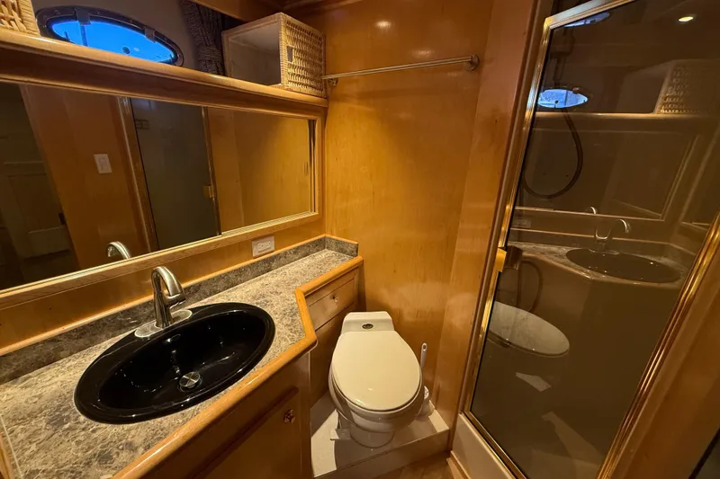 Slide: The Image of Luxurious 1999 Navigator 5300 yacht bathroom with modern fixtures and elegant wood finish. - 45