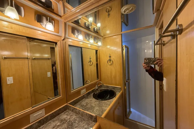 Slide: The Image of Luxurious 1999 Navigator 5300 bathroom with wood accents and modern lighting. - 47