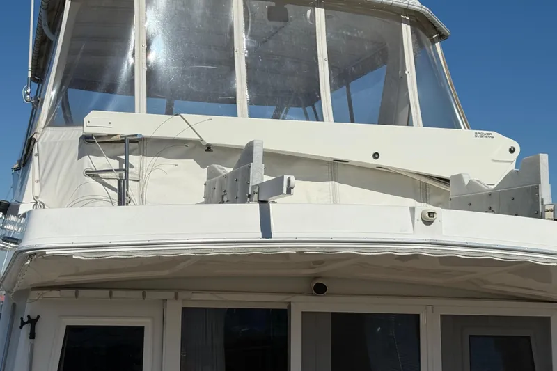 Slide: The Image of 1999 Navigator 5300 yacht with enclosed flybridge and Brower Systems davit. - 5