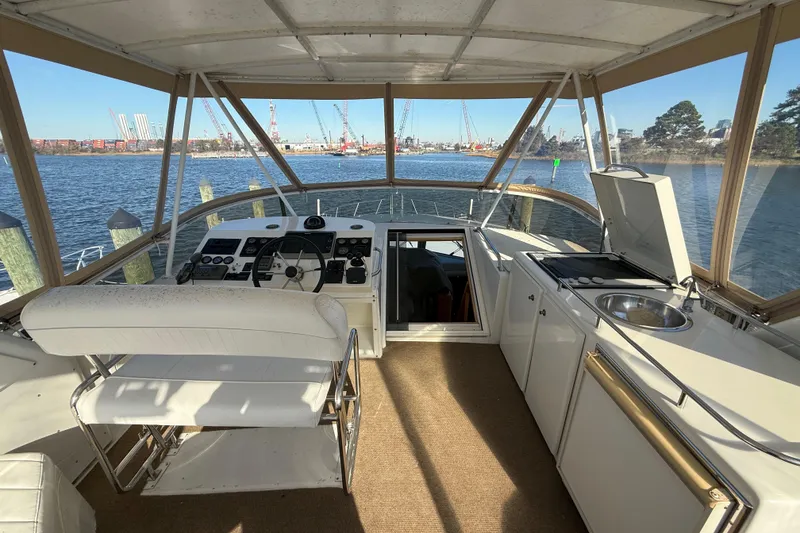 Slide: The Image of Interior view of 1999 Navigator 5300 yacht helm with kitchen and water view. - 58