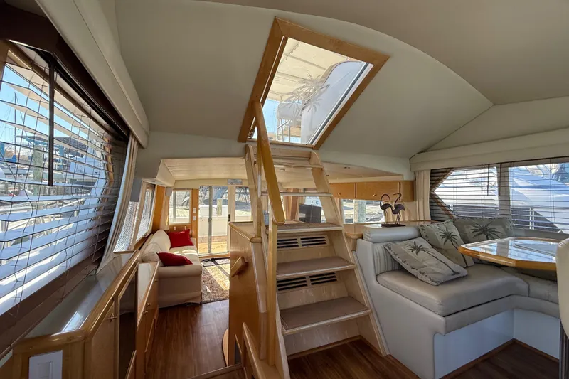 Slide: The Image of Luxurious interior of 1999 Navigator 5300 yacht with elegant seating and wooden accents. - 59