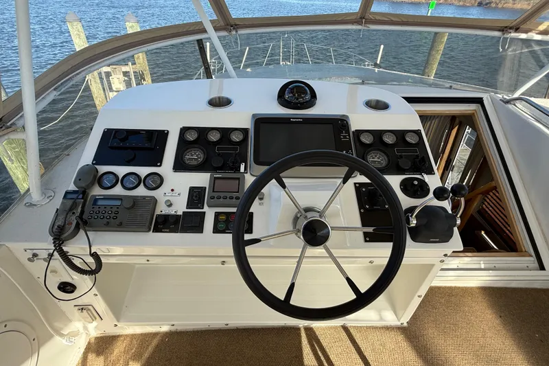 Slide: The Image of Cockpit of 1999 Navigator 5300 yacht with steering wheel and control panel. - 66