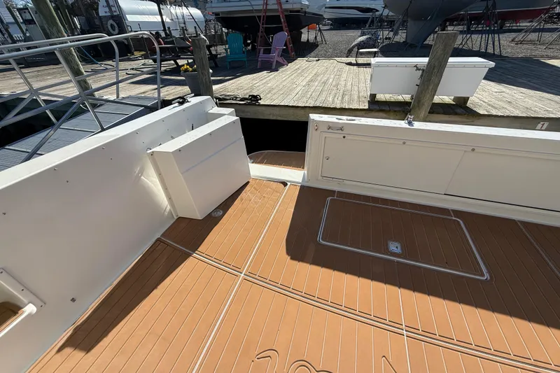 Slide: The Image of 1999 Navigator 5300 yacht deck with wood finish, docked at marina. - 7