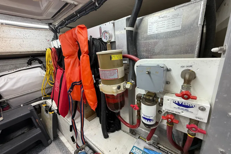 Slide: The Image of Engine room of 1999 Navigator 5300 with safety gear and fuel system components. - 76