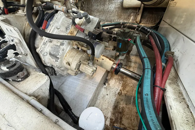 Slide: The Image of Engine compartment of a 1999 Navigator 5300 with visible hoses and mechanical components. - 80