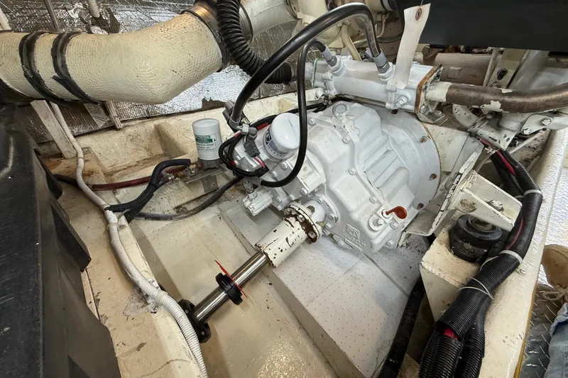 Slide: The Image of Engine compartment of a 1999 Navigator 5300 boat, showcasing mechanical components and wiring. - 81