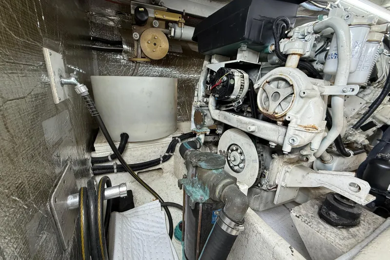 Slide: The Image of Engine room of 1999 Navigator 5300 yacht with visible machinery and components. - 88