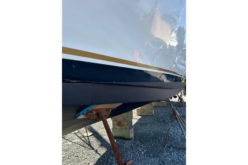 Slide: The Image of 1999 Navigator 5300 yacht hull on dry dock, showcasing sleek design and sturdy construction. - 95