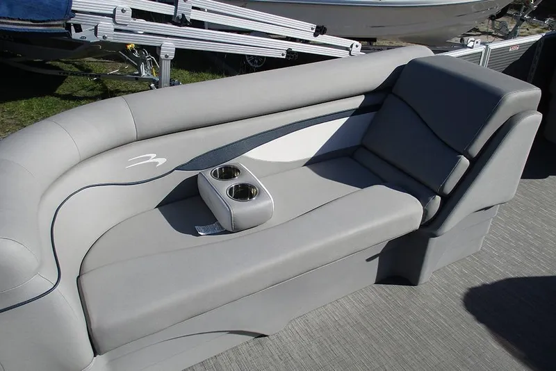 Slide: The Image of 2022 Bennington 20 SSR boat interior with gray seating and cup holders. - 16