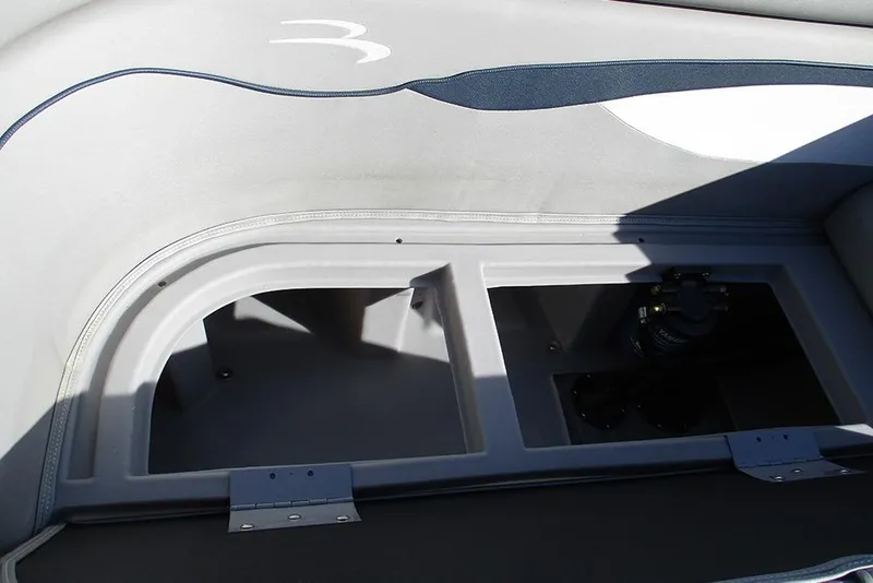 Slide: The Image of 2022 Bennington 20 SSR boat storage compartment with sleek interior design. - 18