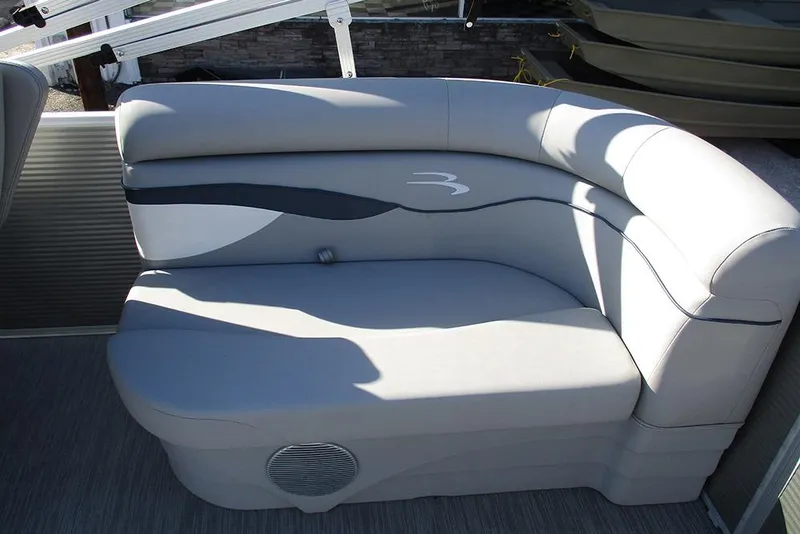 Slide: The Image of Luxurious seating on 2022 Bennington 20 SSR pontoon boat, featuring sleek gray upholstery. - 19