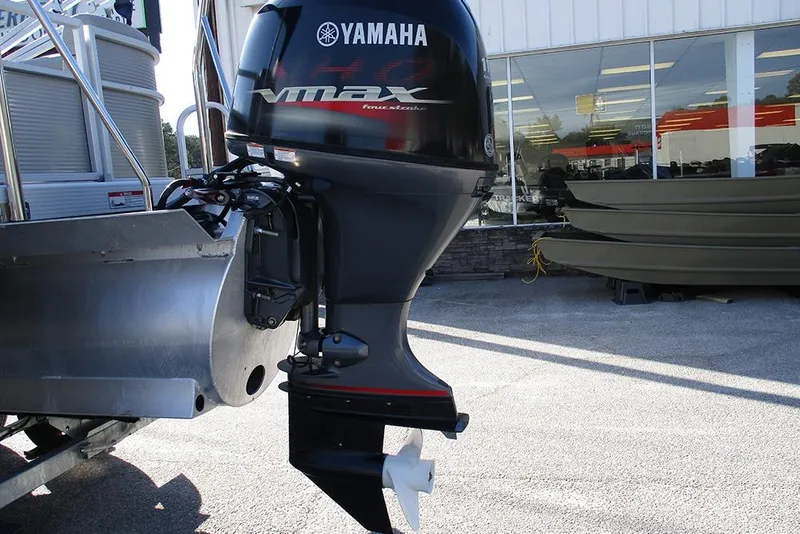Slide: The Image of 2022 Bennington 20 SSR with Yamaha VMAX outboard motor at dealership. - 24