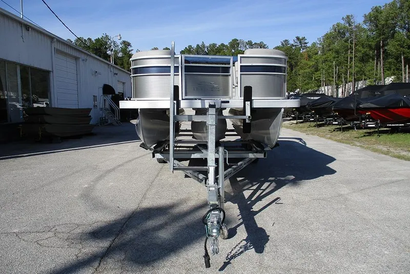 Slide: The Image of 2022 Bennington 20 SSR pontoon boat on trailer in outdoor storage area. - 4