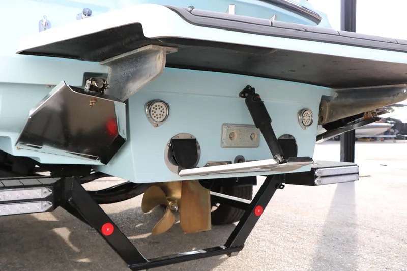 Slide: The Image of 2014 Master Craft X-Star boat stern with propeller and trim tabs visible. - 12