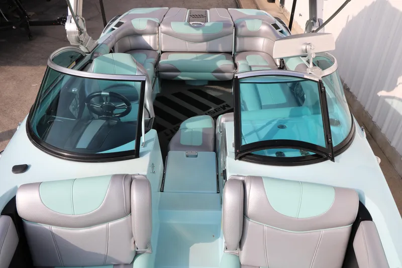 Slide: The Image of 2014 Master Craft X-Star boat interior with aqua and gray seating. - 15