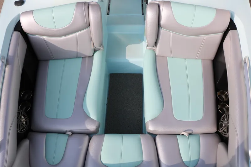 Slide: The Image of 2014 Master Craft X-Star interior with mint and gray seating, featuring cup holders. - 16