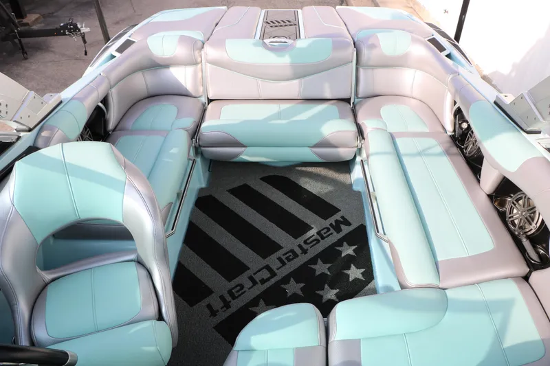 Slide: The Image of 2014 Master Craft X-Star boat interior with aqua and gray seating. - 19