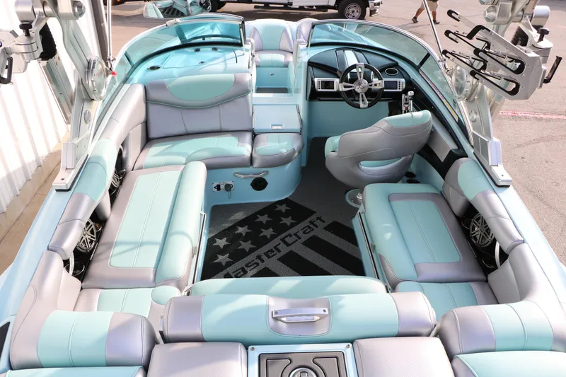 Slide: The Image of Interior of a 2014 Master Craft X-Star boat with luxurious seating and modern dashboard. - 21
