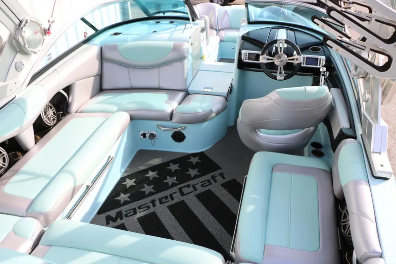 Slide: The Image of 2014 Master Craft X-Star boat interior with luxurious seating and modern dashboard design. - 24
