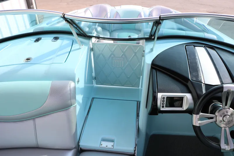 Slide: The Image of Interior of a 2014 Master Craft X-Star boat with sleek design and modern dashboard. - 35