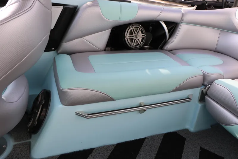 Slide: The Image of 2014 Master Craft X-Star interior seating with teal and gray upholstery. - 36