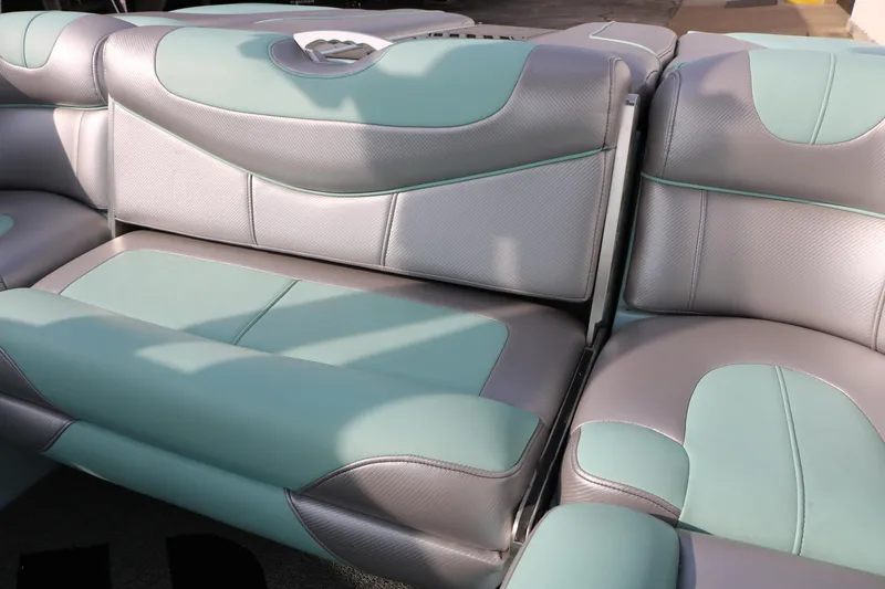 Slide: The Image of 2014 Master Craft X-Star boat interior with teal and gray seating. - 37