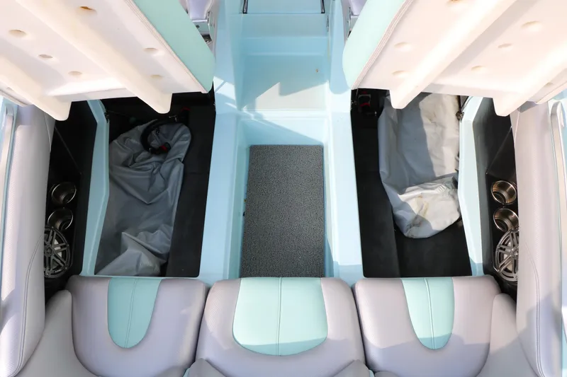 Slide: The Image of Interior view of a 2014 Master Craft X-Star boat, showcasing seating and storage compartments. - 38
