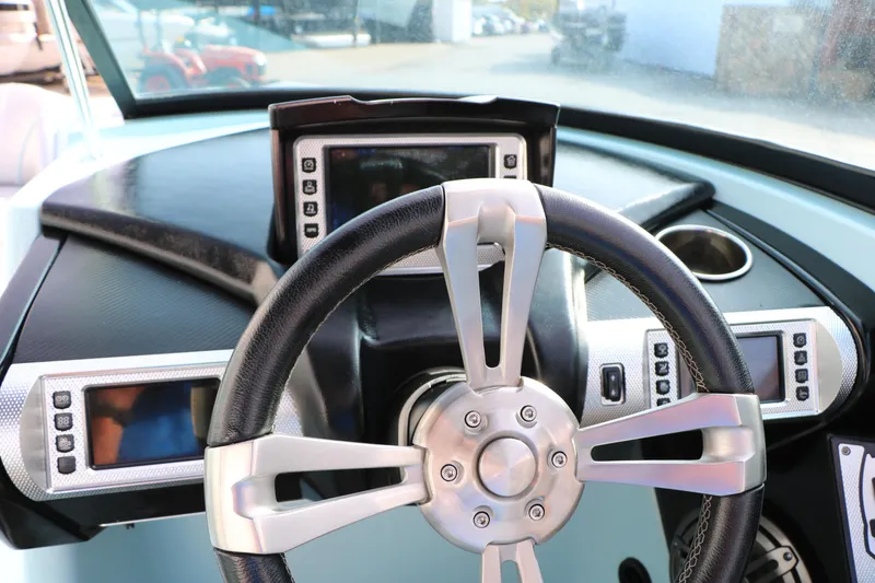 Slide: The Image of Steering wheel and dashboard of 2014 Master Craft X-Star boat with digital displays. - 39