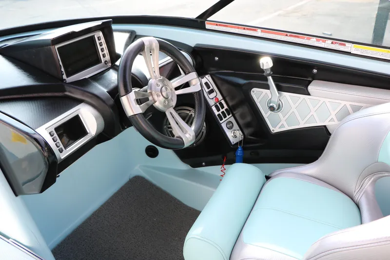 Slide: The Image of 2014 Master Craft X-Star boat interior with modern dashboard and steering wheel. - 42