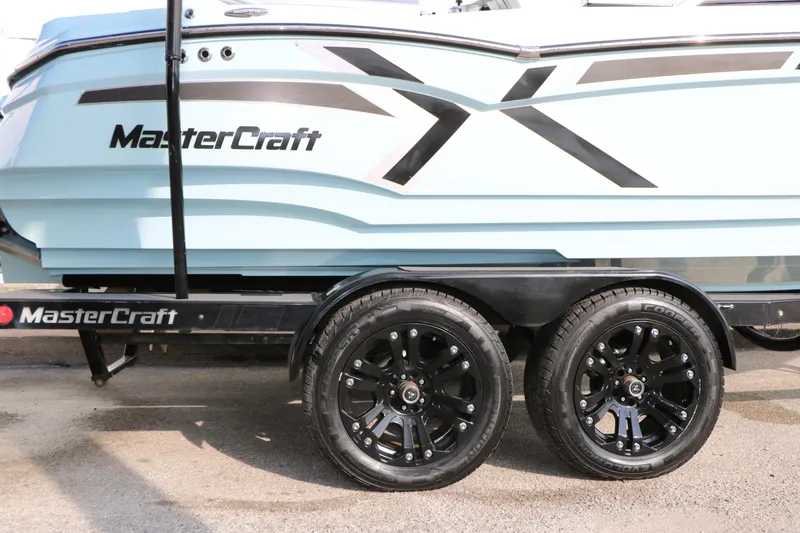 Slide: The Image of 2014 Master Craft X-Star boat on trailer with black wheels. - 43