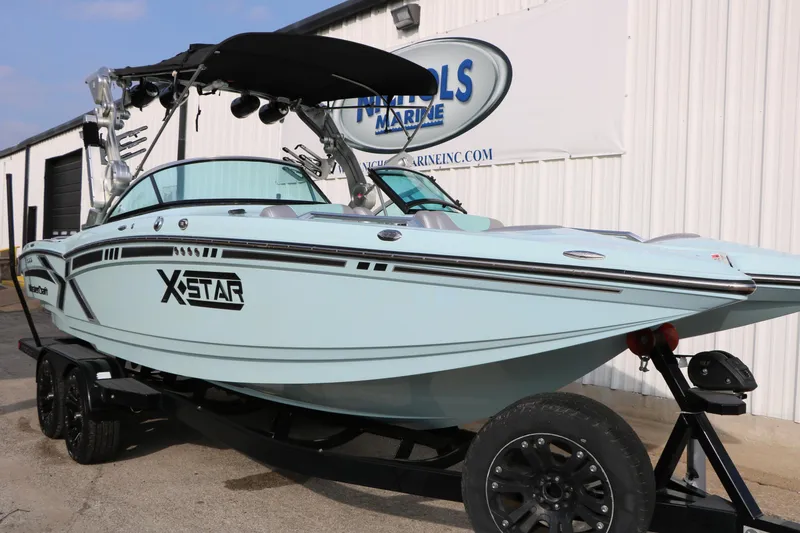 Slide: The Image of 2014 Master Craft X-Star boat on trailer outside marine dealership. - 5