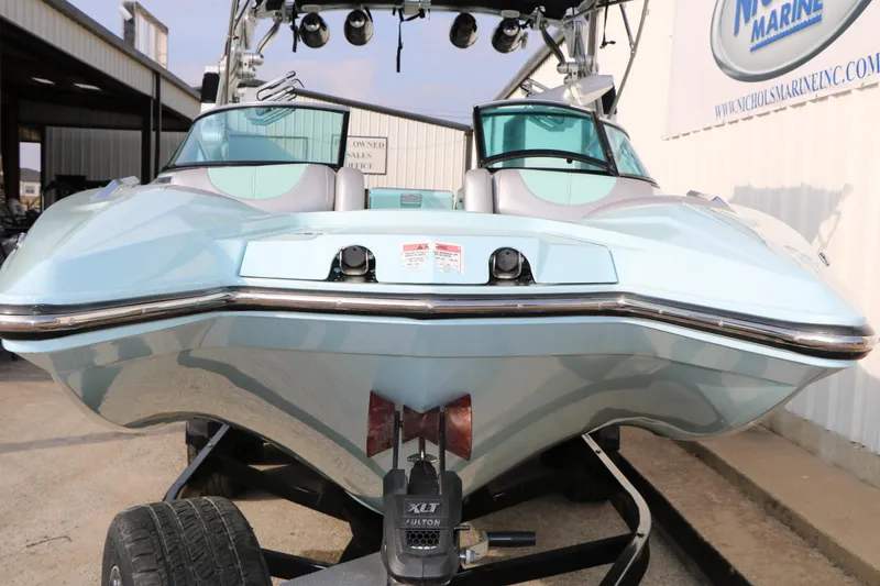 Slide: The Image of 2014 Master Craft X-Star boat on trailer, front view, light blue color. - 8