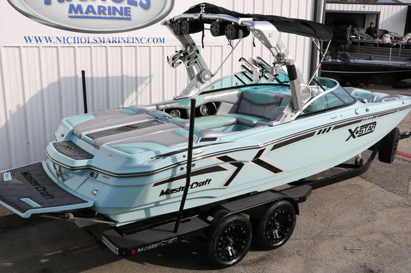 Slide: The Image of 2014 Master Craft X-Star boat on trailer at Nichols Marine dealership. - 9