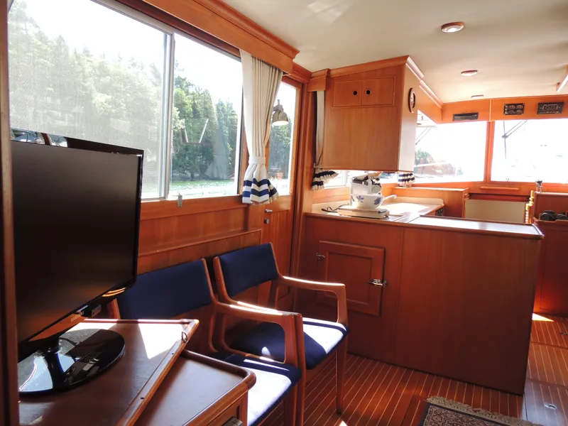 Slide: The Image of Interior of 2002 Grand Banks 42 Classic yacht with wood finish and seating area. - 41