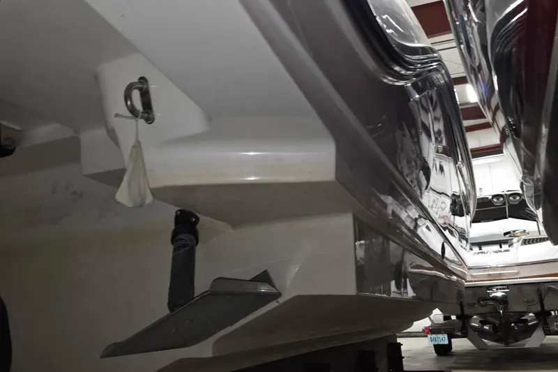 Slide: The Image of 2017 Sea Ray SLX 280 boat hull in storage, showcasing sleek design and structure. - 10